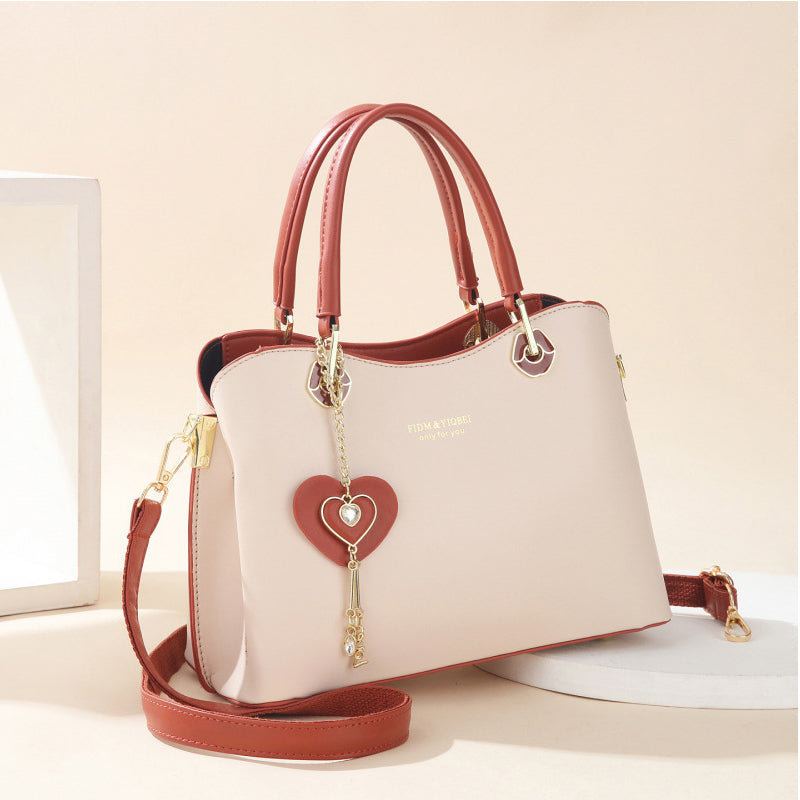 👜 LIMITED-TIME 50% OFF! ✨Elegant Heart Charm Tote Bag | Soft Faux Leather Crossbody with Adjustable Strap | Spacious Women's Shoulder Handbag💖